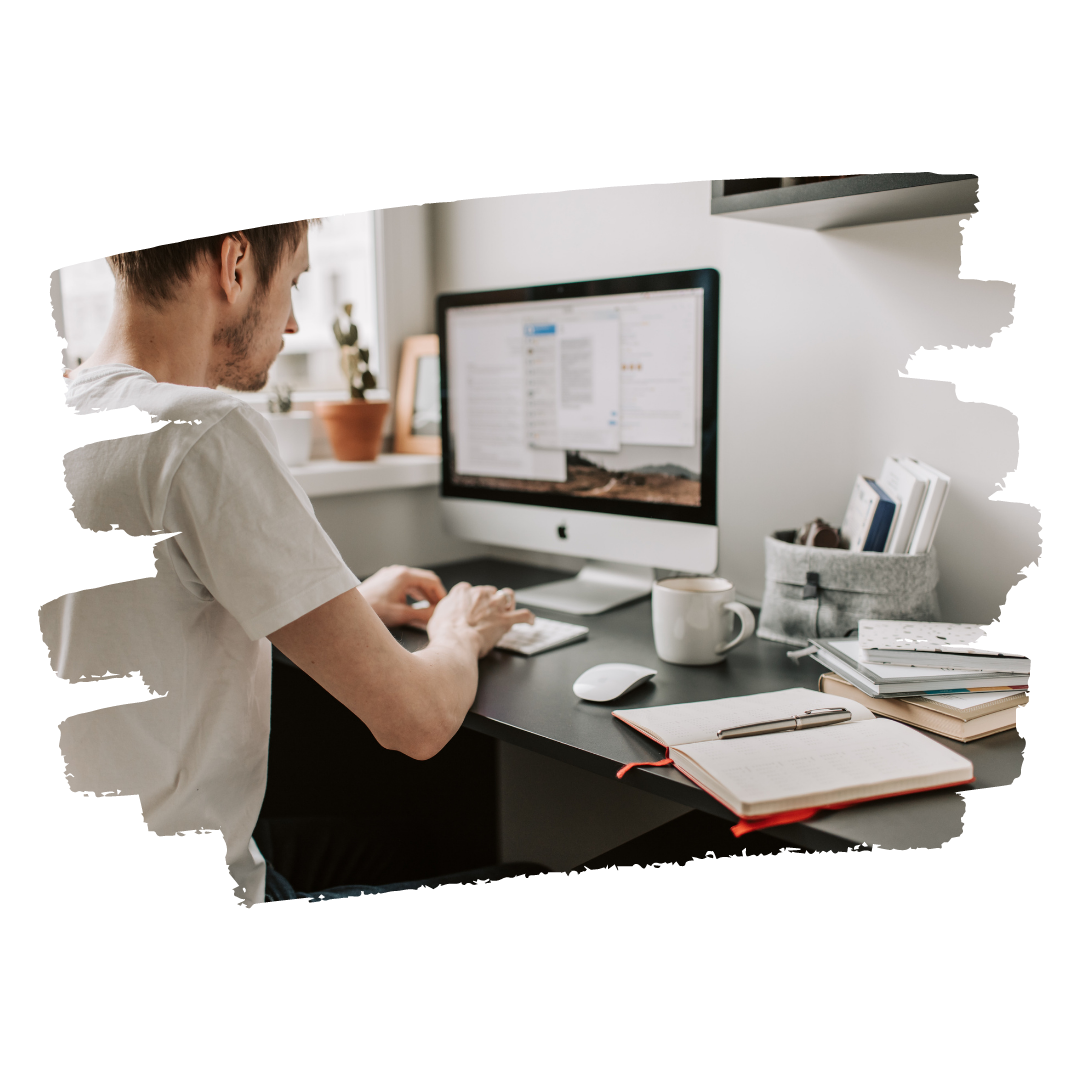 man sitting in front of a computer applying for a job with career jump