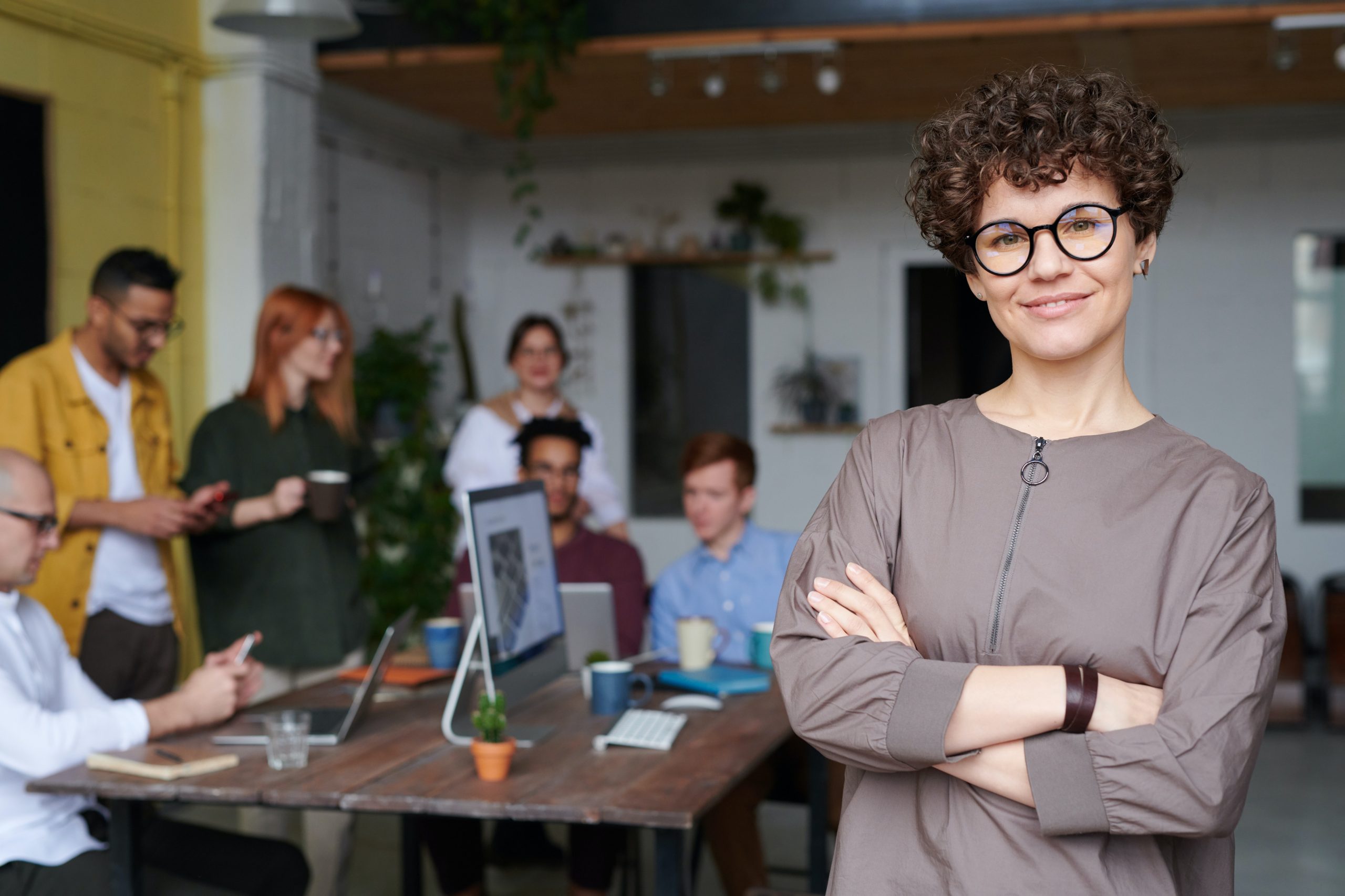 4 ways to find out what you are good at a woman posing and smiling in an office