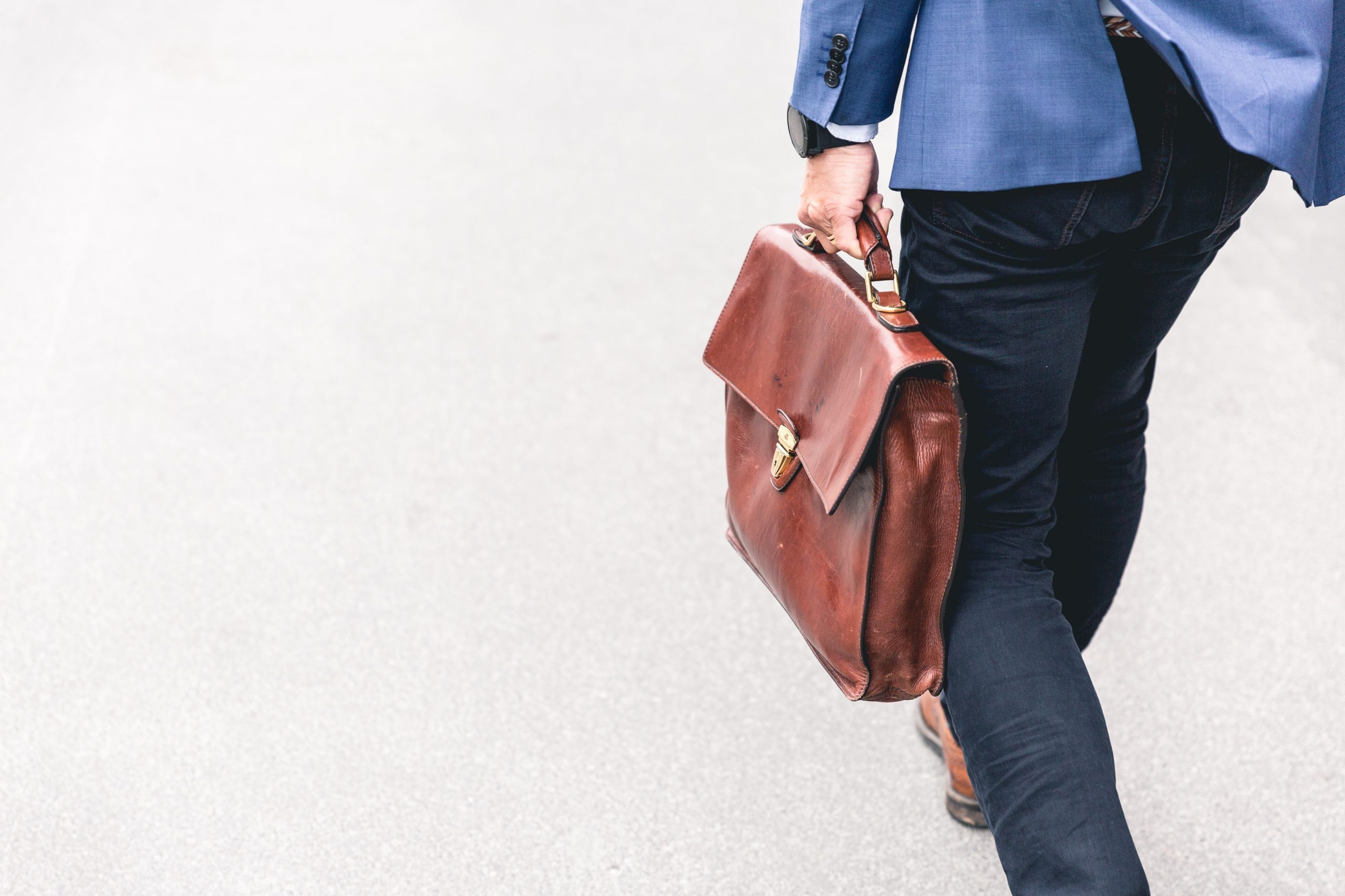 redundancy, now what a man carrying a brown bag
